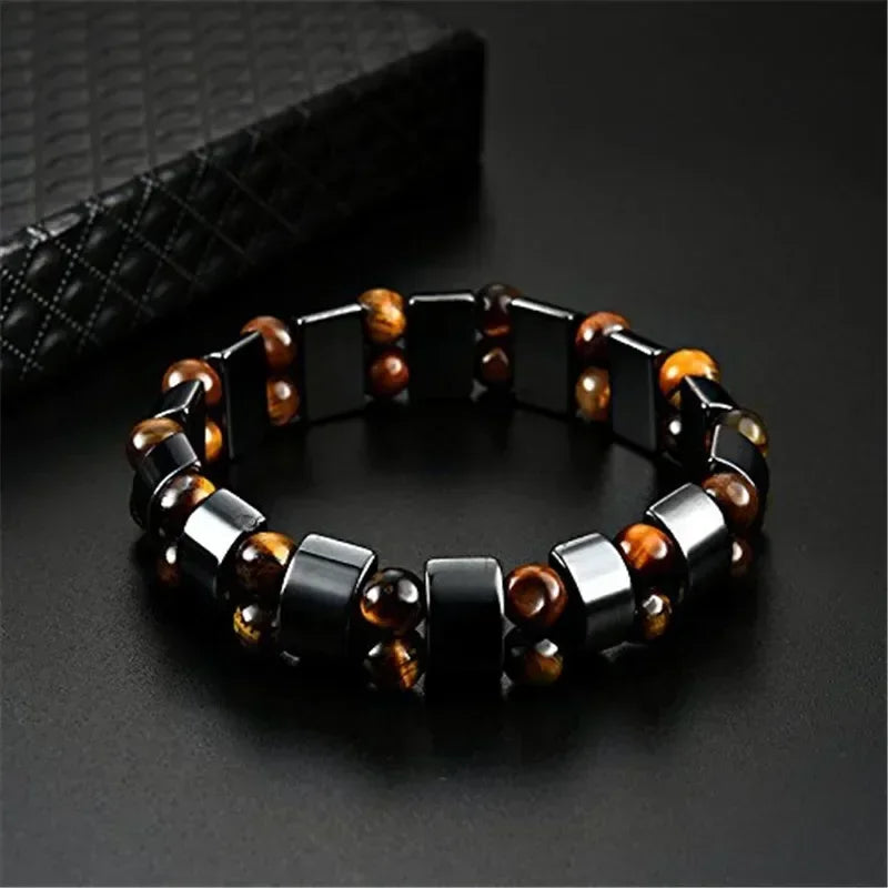 Bracelet with black and brown beads on a dark background
