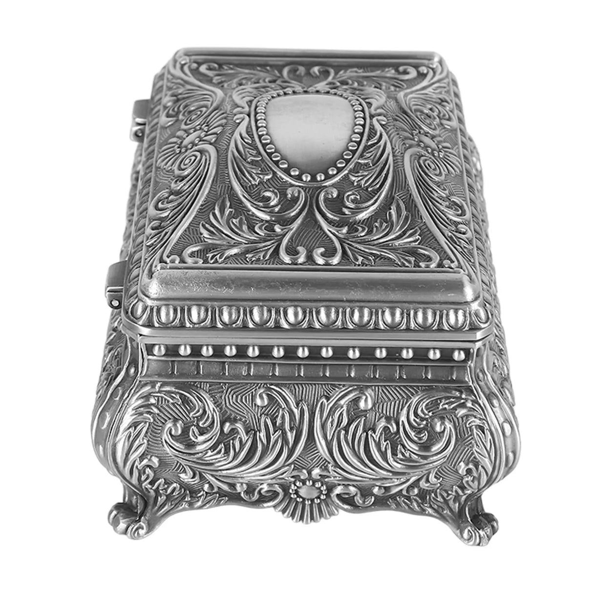 Decorative silver box with intricate patterns on a white background