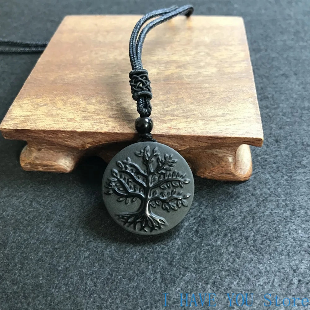 Necklace with tree-of-life pendant on a wooden stand