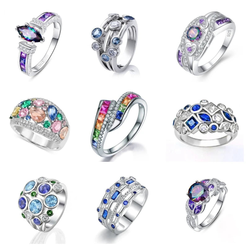 Collection of silver rings with colorful gemstones on a white background