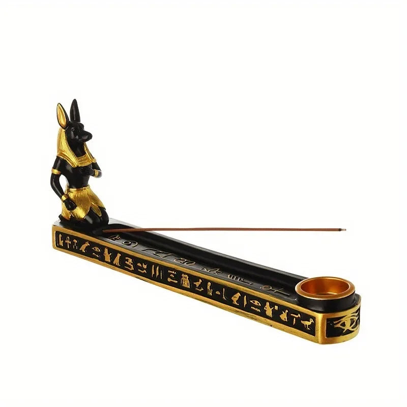 Incense burner with Anubis figure and hieroglyphics on a white background