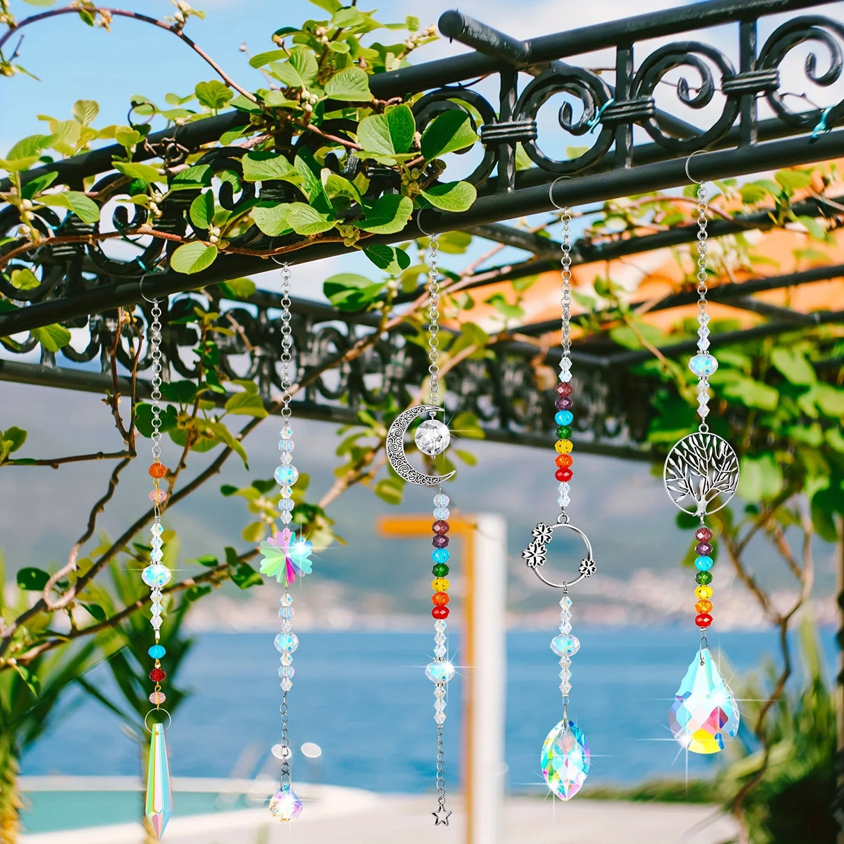 Decorative hanging chains with beads and crystals against a scenic background
