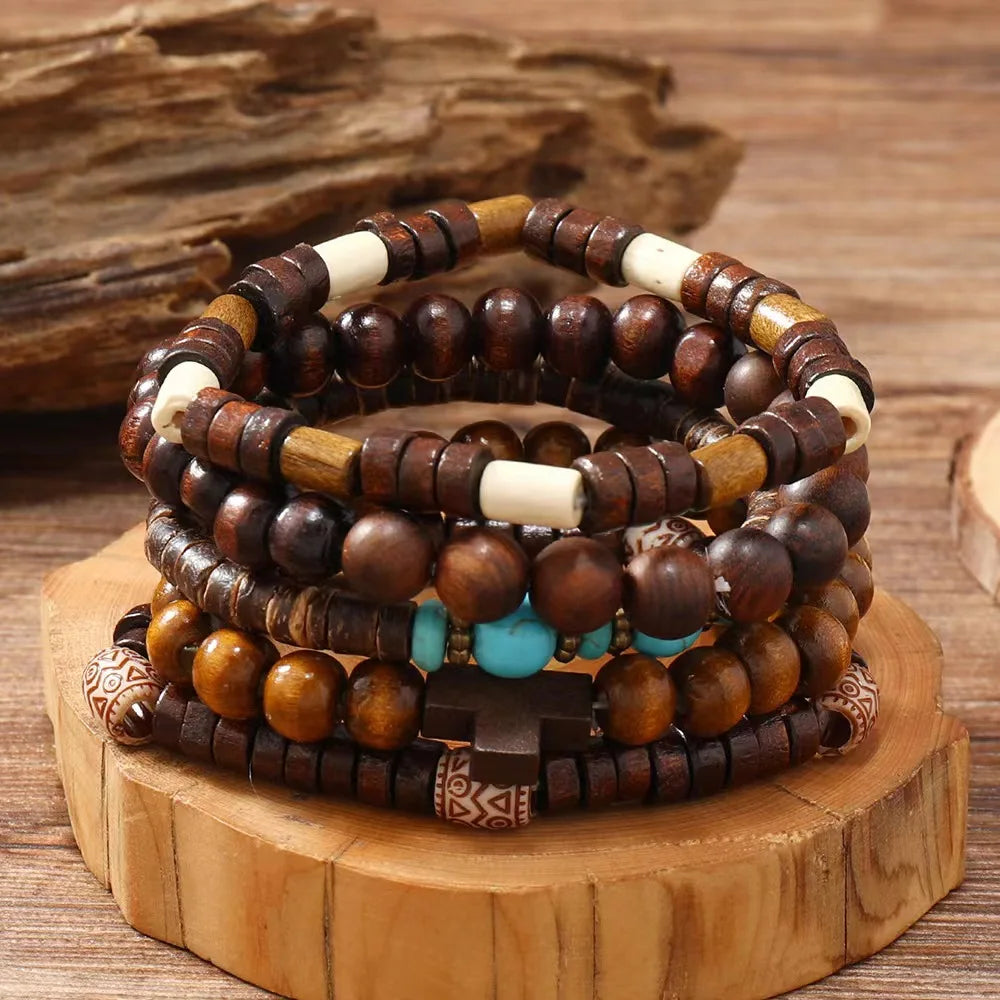 Stack of wooden beaded bracelets on a wooden stand with a wooden background