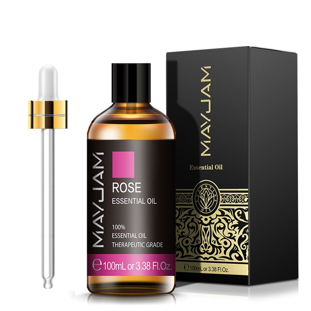 Rose essential oil bottle with dropper and packaging on a white background