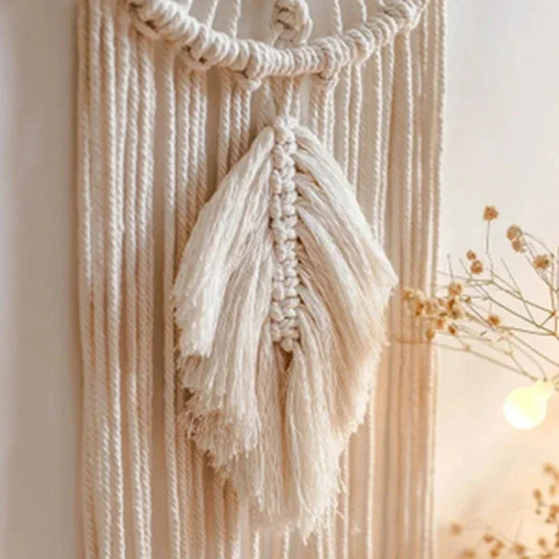 Macrame wall hanging with tassels on a neutral background