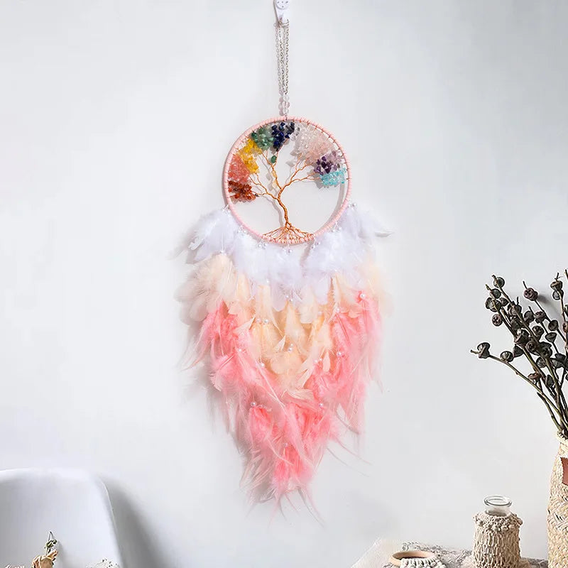 Decorative dreamcatcher with feathers and a colorful design on a white background