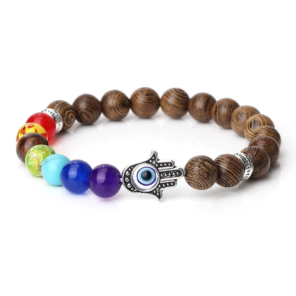 Bracelet with wooden beads, colorful marbles, and a hamsa hand charm on a white background