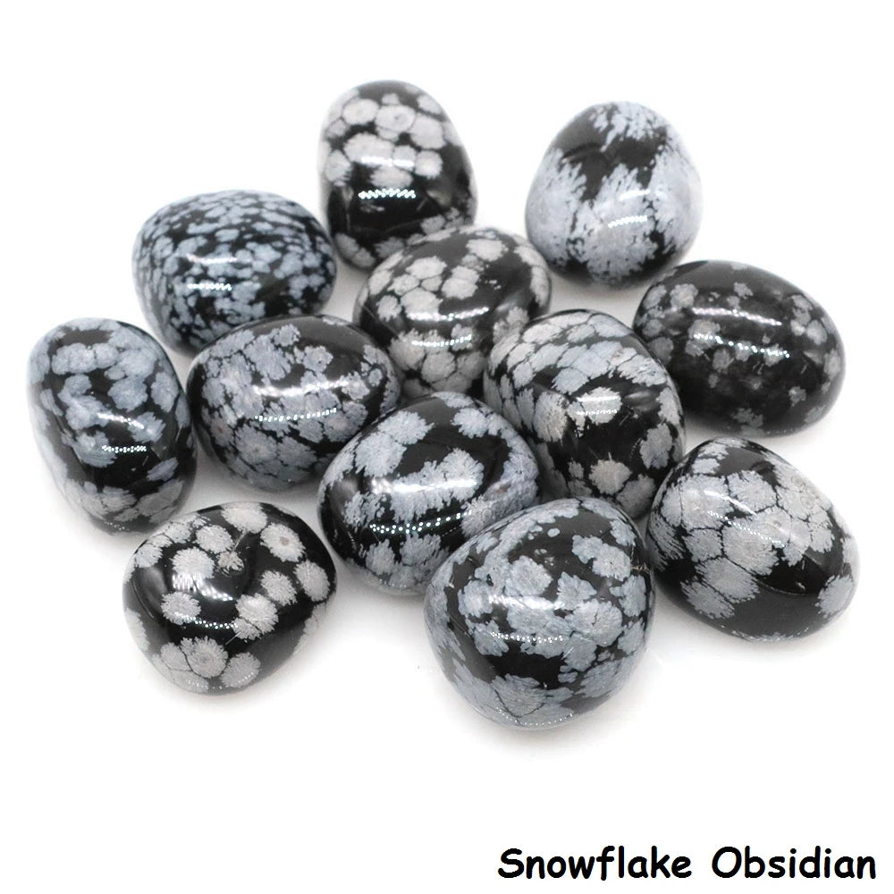 Collection of snowflake obsidian stones on a white background