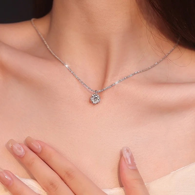 Diamond necklace on a person's neck with a blurred background