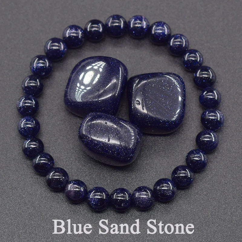 Blue sandstone beads and tumbled stones on a gray background with 'Blue Sand Stone' text.