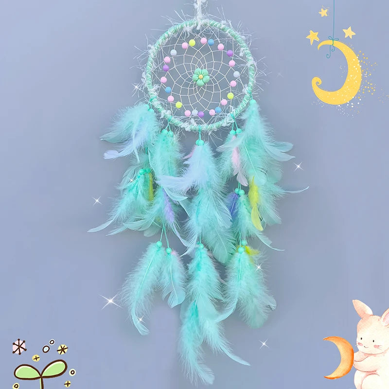 Turquoise dreamcatcher with colorful beads and feathers on a light blue background