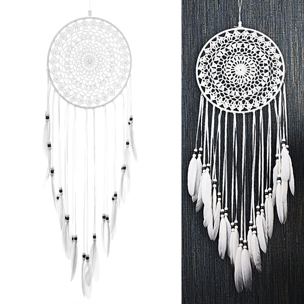 White dreamcatcher with feathers on a white background