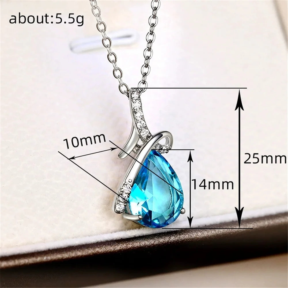 Blue teardrop pendant necklace on a white background