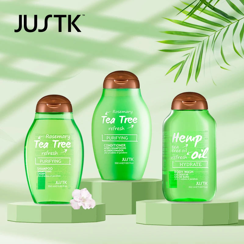 JUSTK green skincare and hair care products on a light green background with leaves.