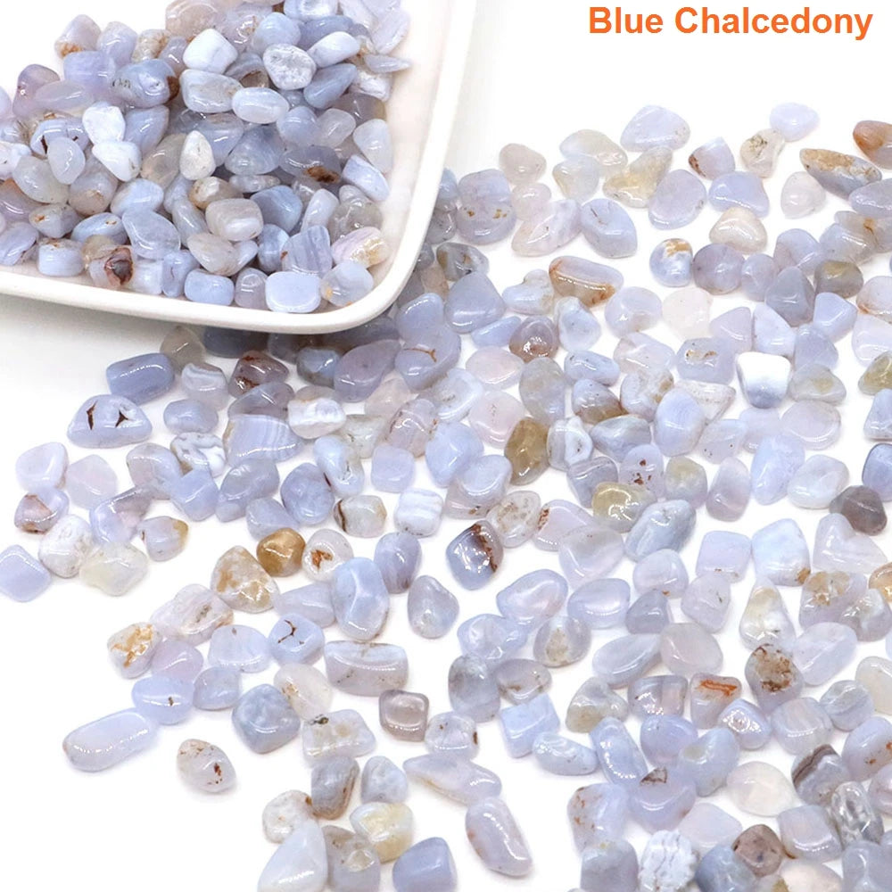 Blue chalcedony stones with a white scoop on a light background