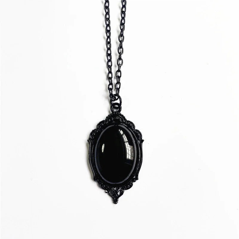 Black pendant necklace on a white background