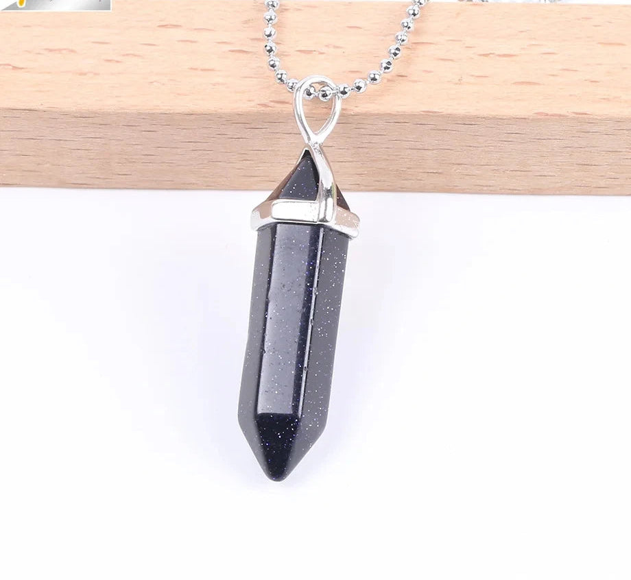 Black crystal pendant necklace on a white background