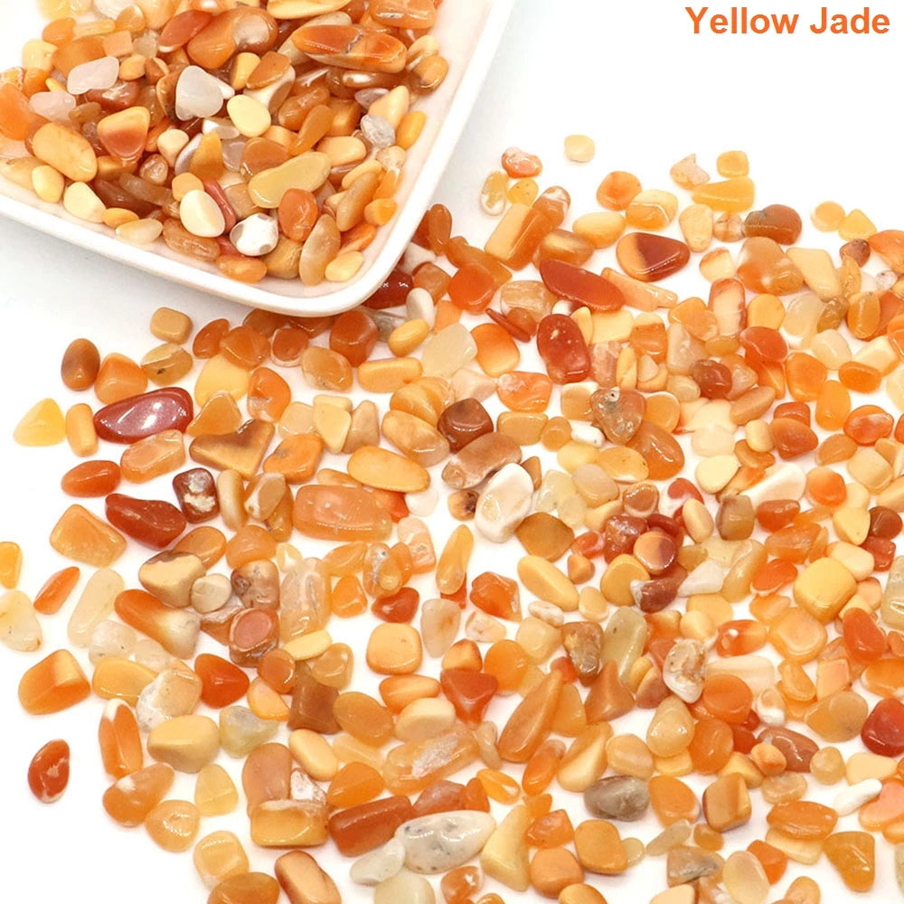 Yellow jade stones with a white bowl on a white background