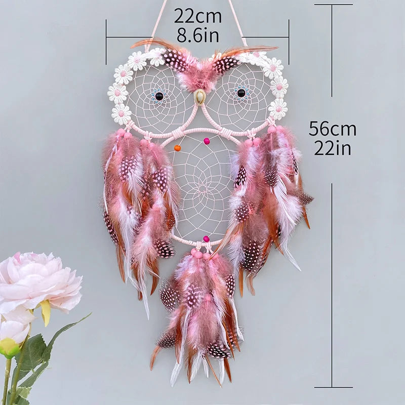 Decorative dreamcatcher with feathers and measurements on a light gray background