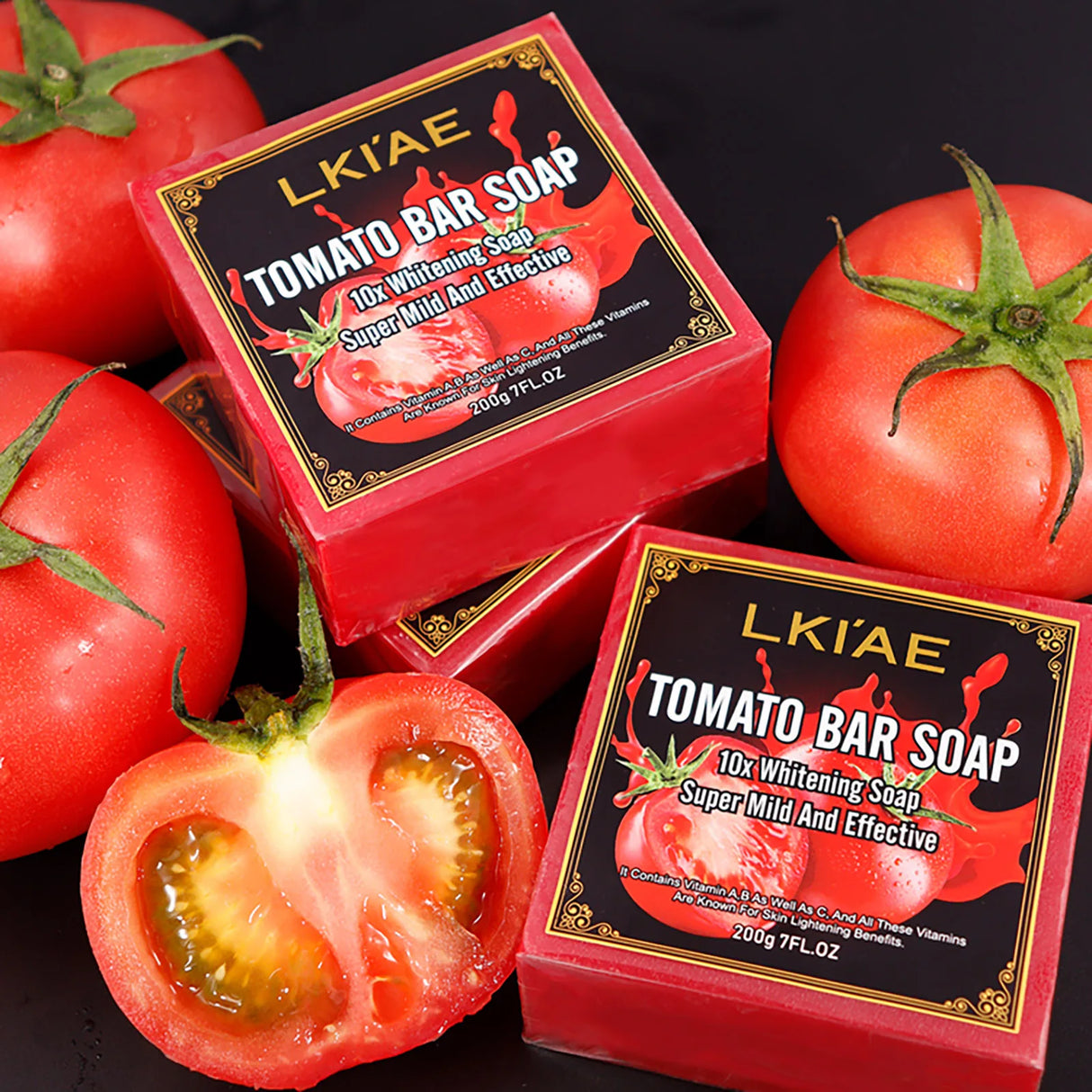 Two boxes of LKIAE Tomato Bar Soap with fresh tomatoes on a dark background