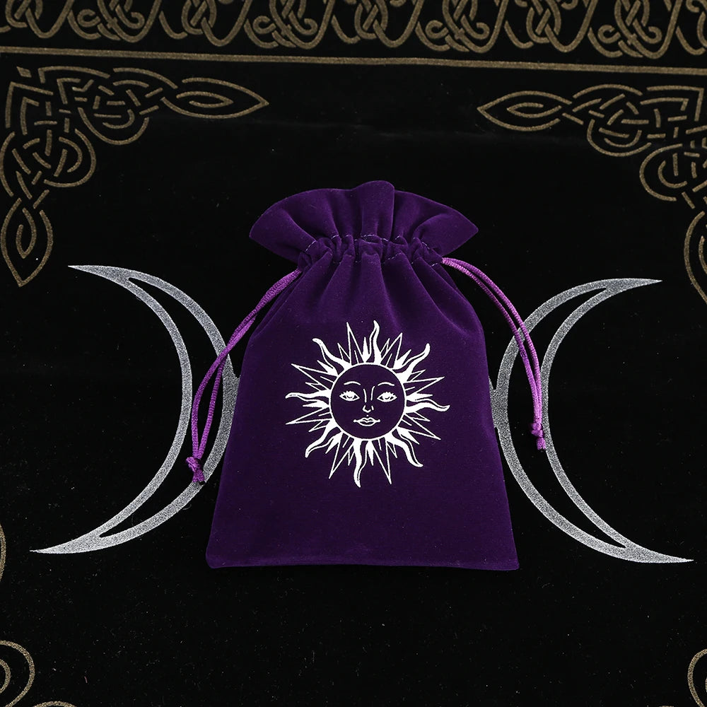 Purple drawstring bag with sun and moon design on a black background with Celtic patterns
