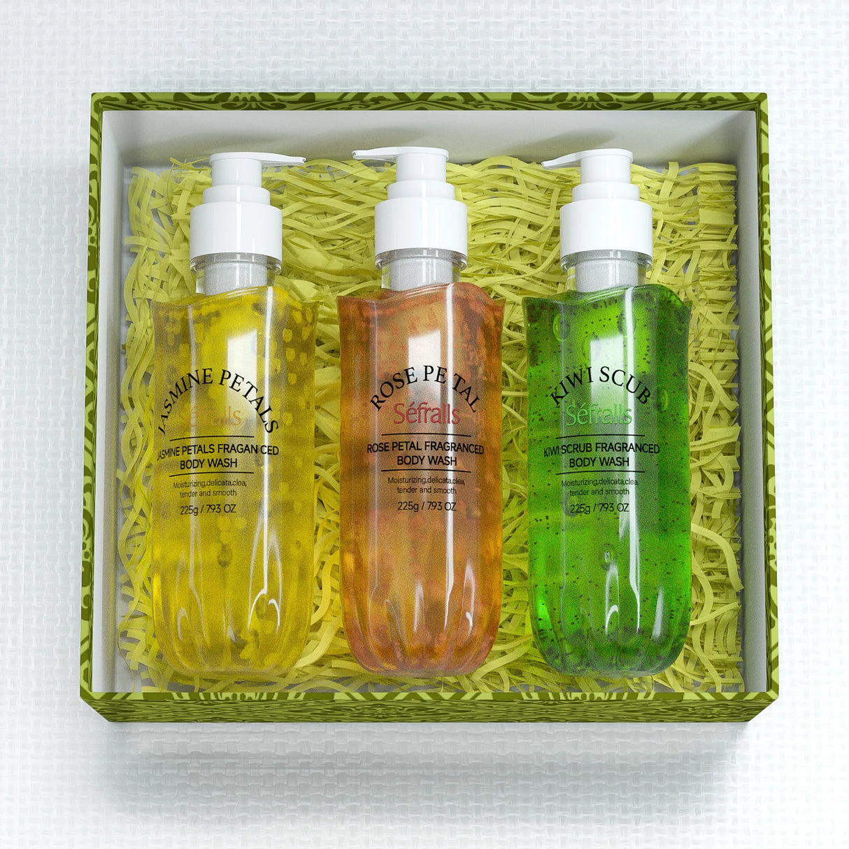Three bottles of body wash in a decorative box with green and white accents.