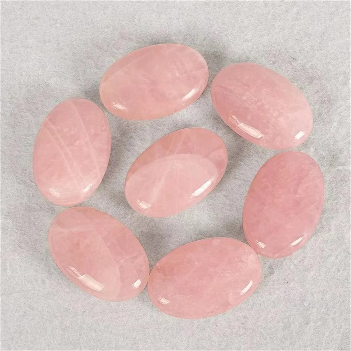Set of pink stones on a gray background