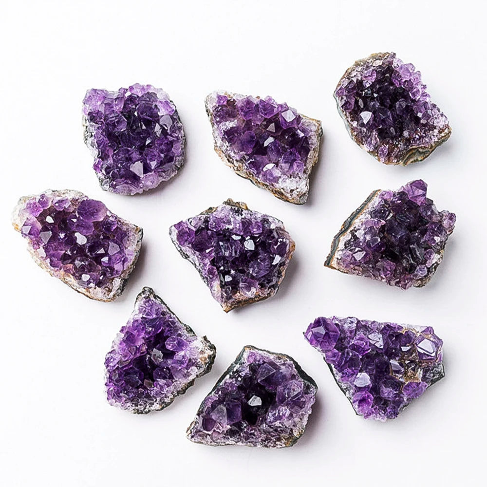 Purple amethyst geodes on a white background