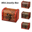Miniature jewelry box with intricate designs and a decorative clasp on a white background.