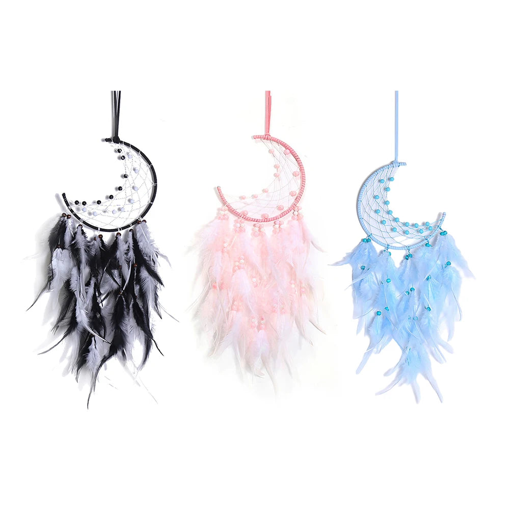 Three dreamcatchers with feathers in black, pink, and blue on a white background