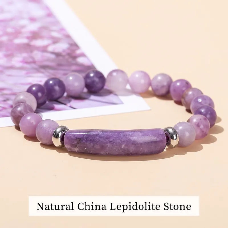 Purple beaded bracelet with silver accents on a beige background, labeled 'Natural China Lepidolite Stone'.