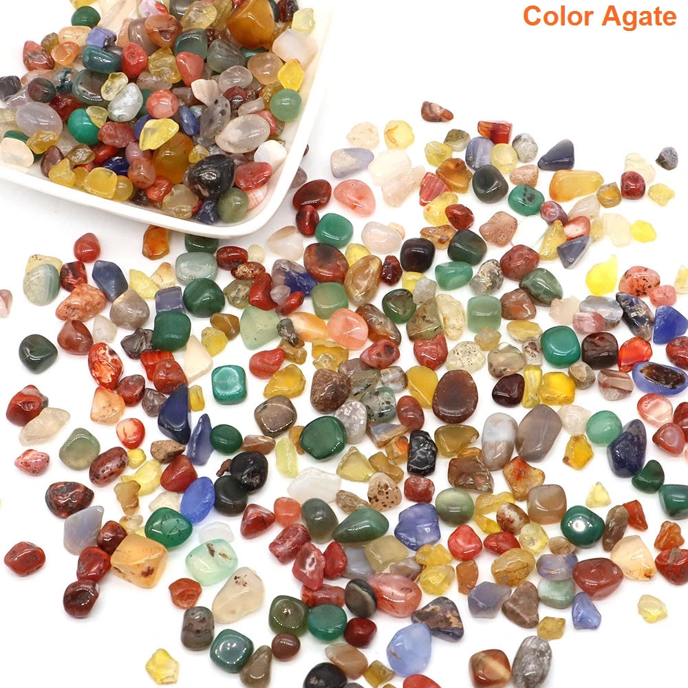 Colorful agate stones with a white bowl on a white background