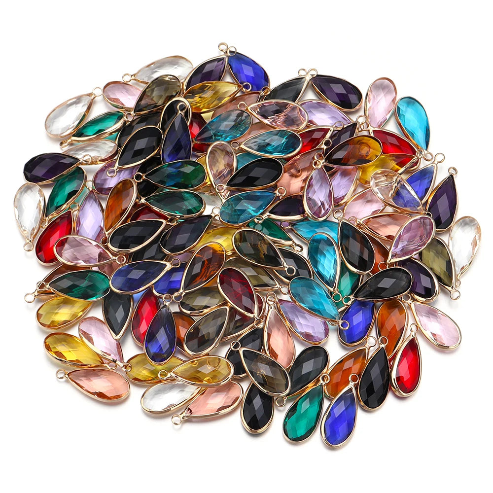 Colorful teardrop-shaped gemstones on a white background