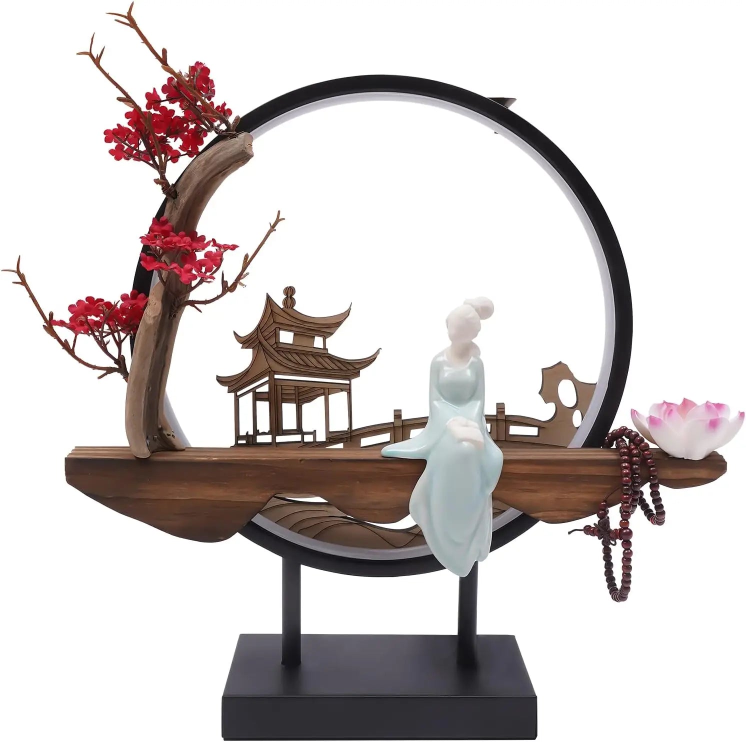 Decorative sculpture with a figure, tree, and traditional architecture on a white background