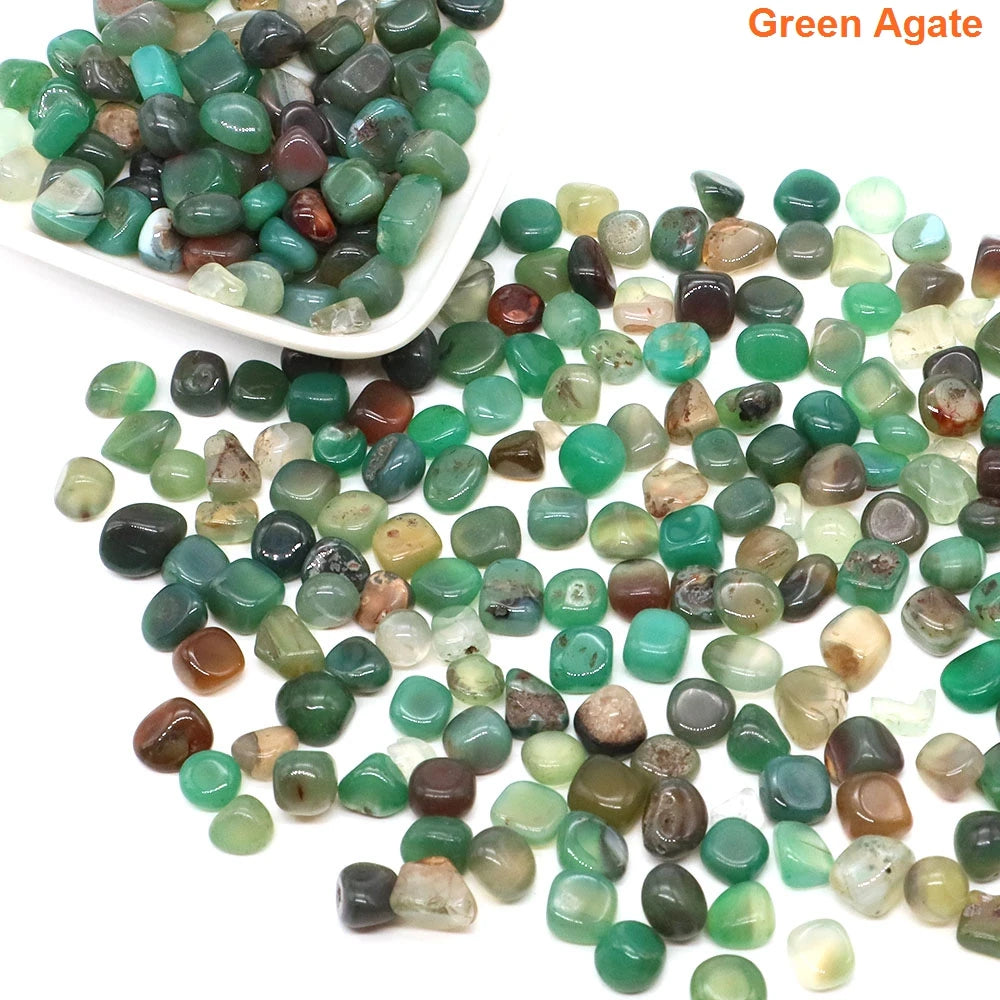 Green agate stones with a white scoop on a white background