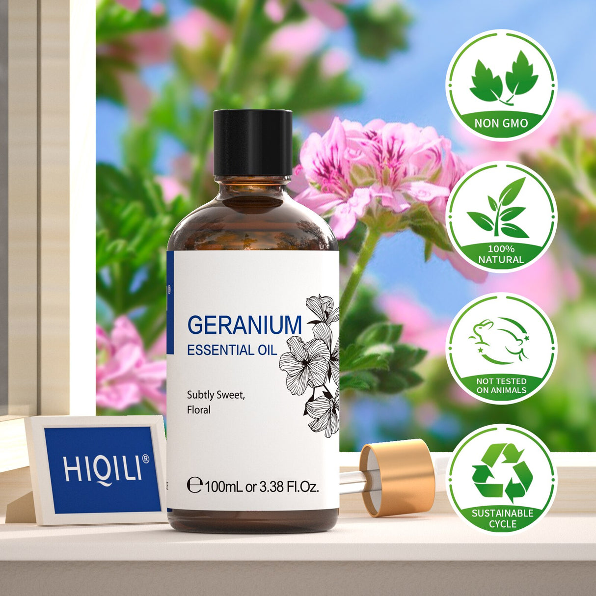 Geranium essential oil bottle with HIQILI branding on a blurred floral background