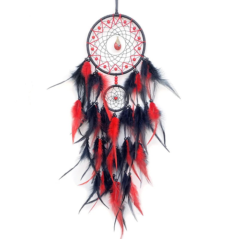 Dreamcatcher with red and black feathers on a white background