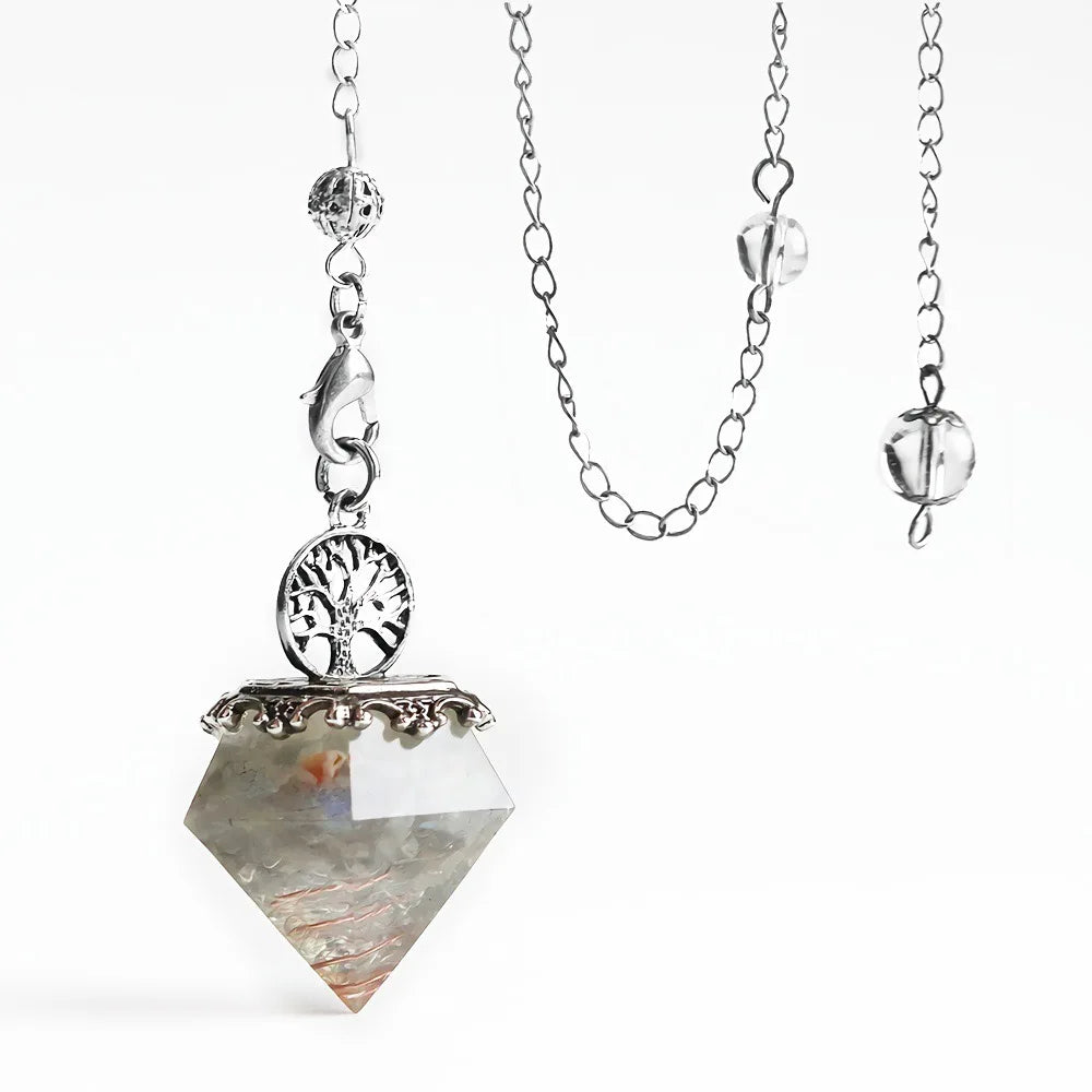 Necklace with a crystal pendant and tree of life symbol on a white background