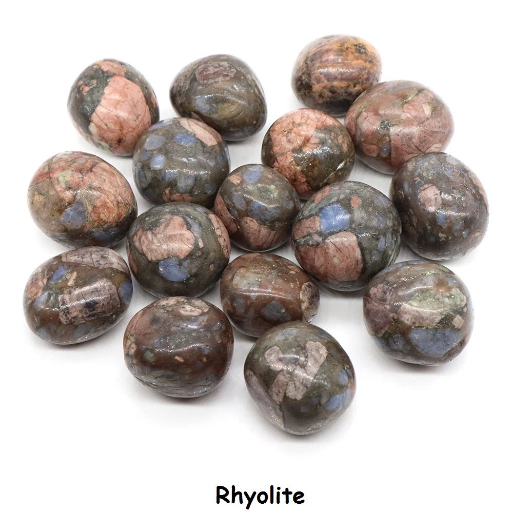 Collection of rhyolite stones on a white background