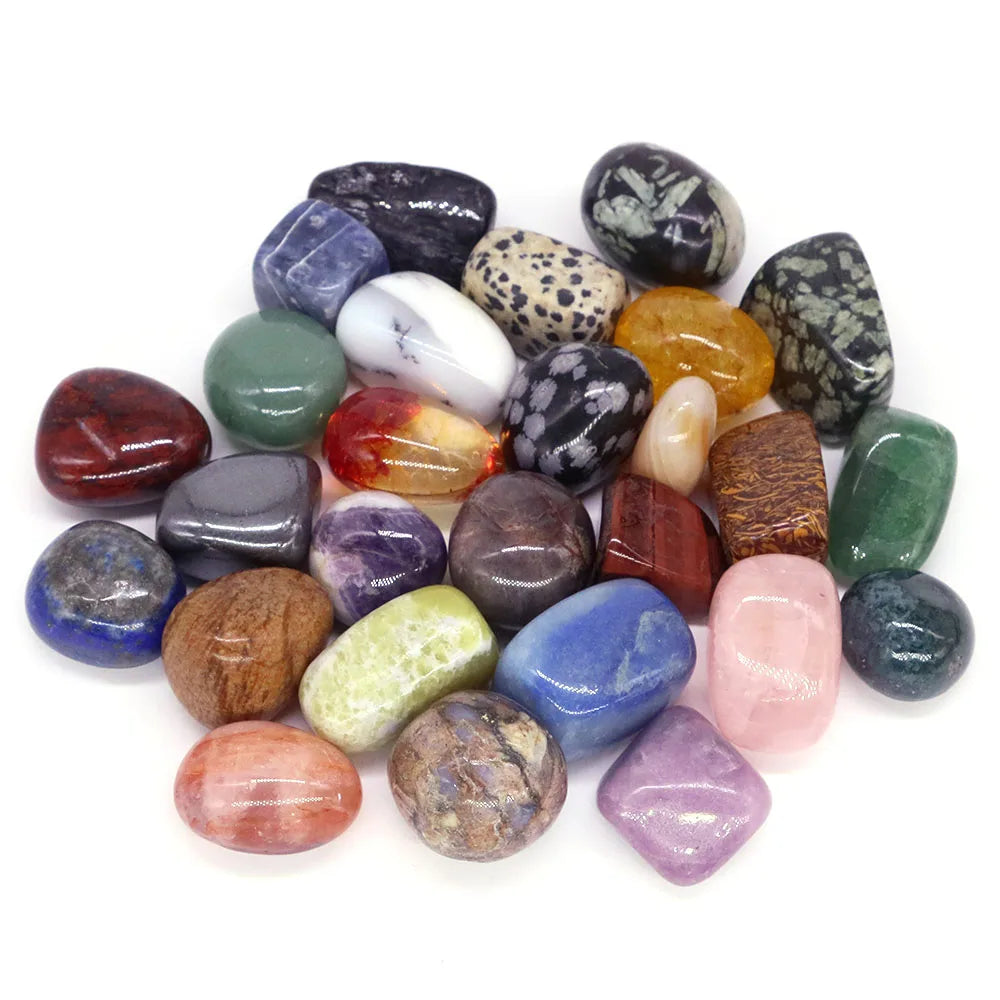 Assorted colorful stones on a white background