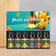 Set of fruit-scented oils with colorful packaging featuring fruits on a gradient background.