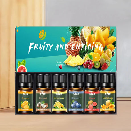 Set of fruit-scented oils with colorful packaging featuring fruits on a gradient background.