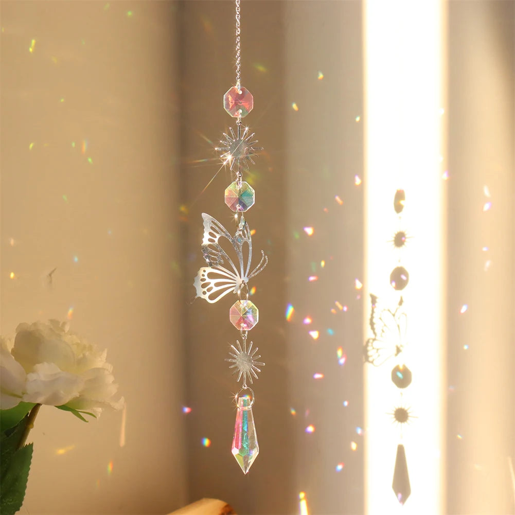 Decorative hanging crystal with butterfly design in front of a light curtain
