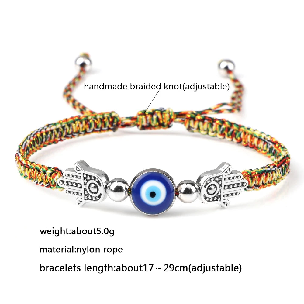 Colorful braided bracelet with evil eye and hamsa hand charm on a white background