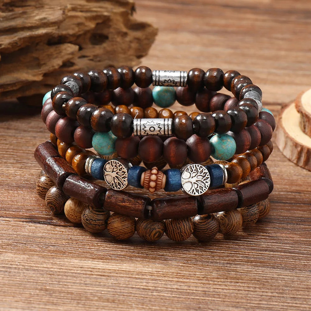Stack of wooden beaded bracelets with metal accents on a wooden surface
