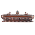 Decorative copper incense holder with intricate designs on a white background