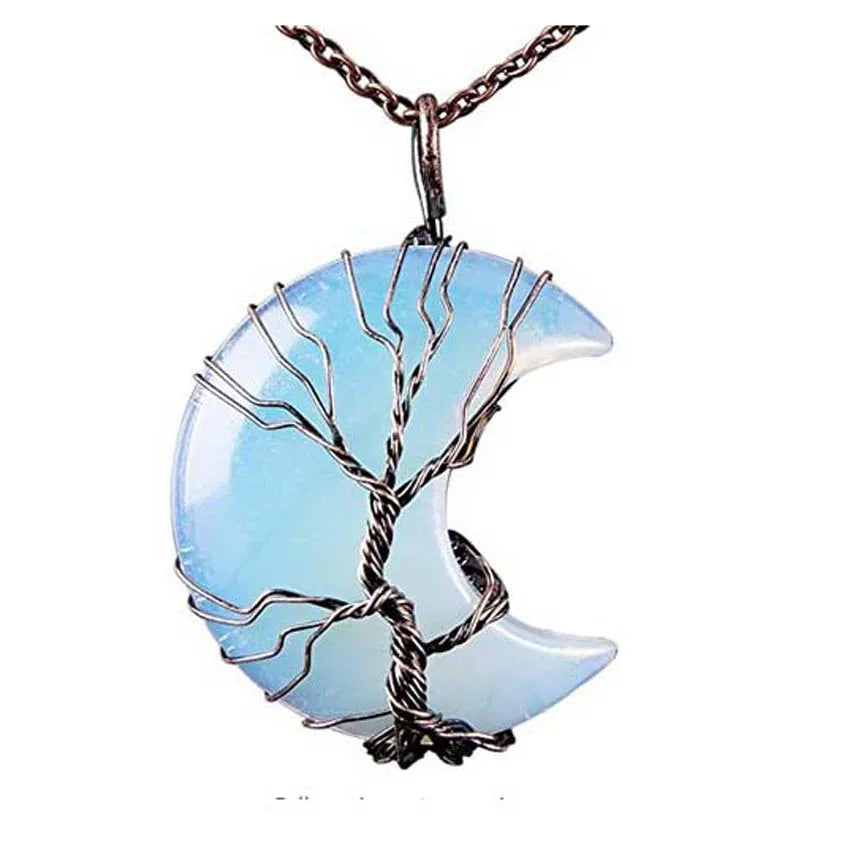 Blue crescent moon pendant with tree design on a white background