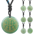 Green pendant necklace with gold symbols on a white background, featuring the brand 'VGDS'.