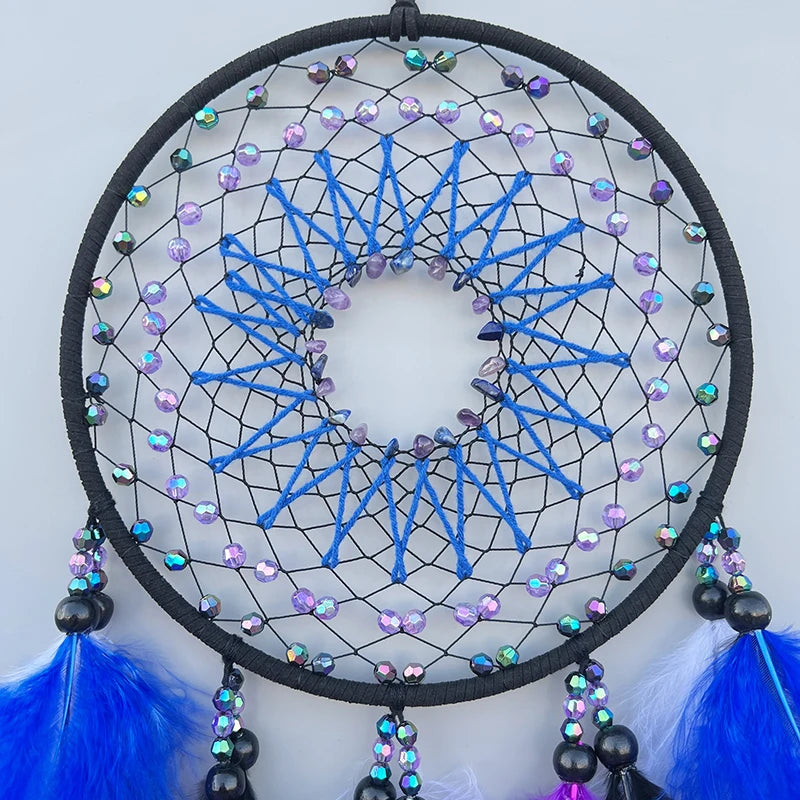 Dreamcatcher with blue and multicolored beads on a white background