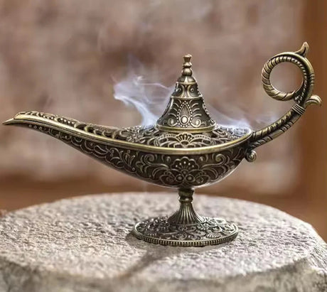 Decorative incense burner with intricate designs on a textured surface, featuring the brand 'SAJENH'.